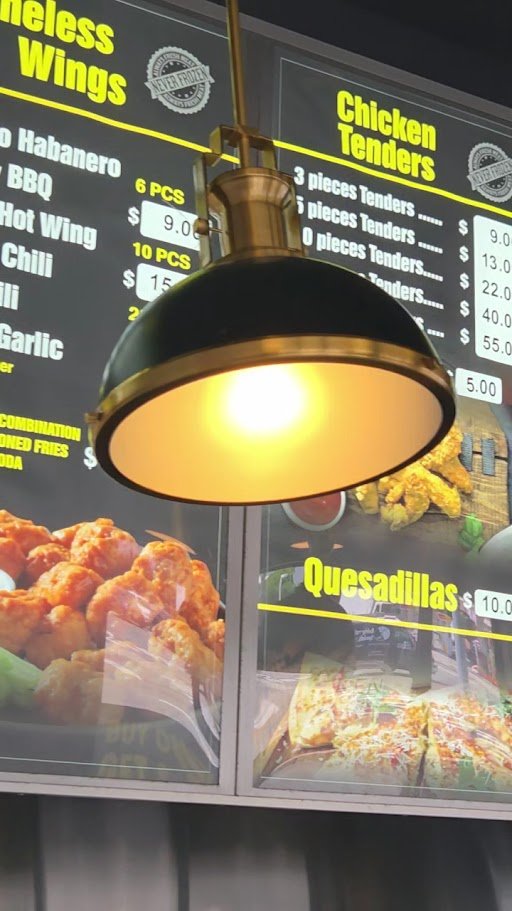 Prepared platters behind a restaurant counter.